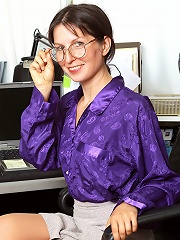 Watch this sexy mature office chick as she spreads for the camera